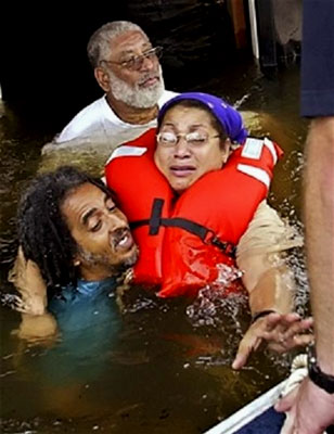 A distraught woman is brought to safety